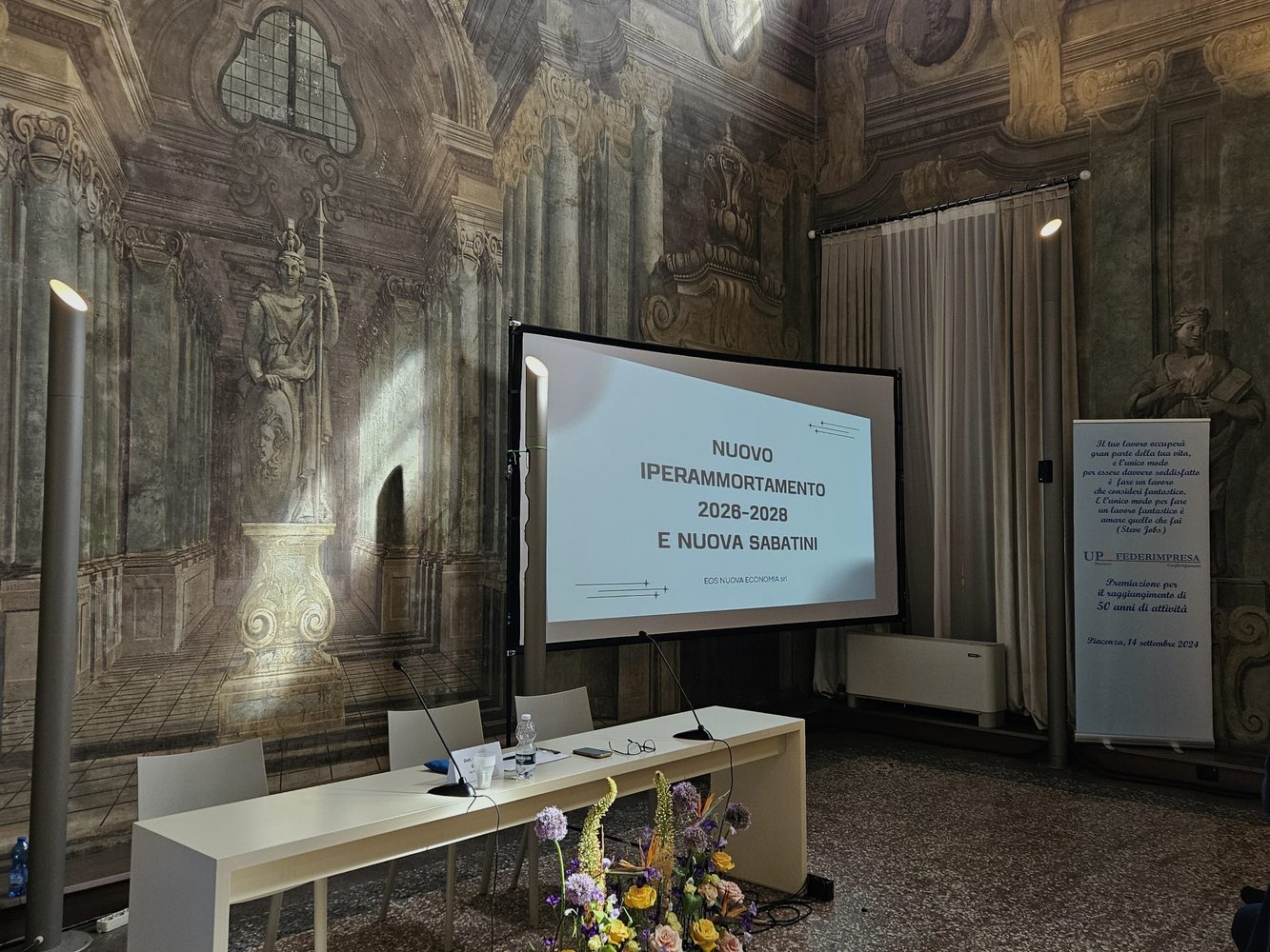 Sala del convegno a Palazzo Costa con presentazione sull'Iperammortamento 2026-2028